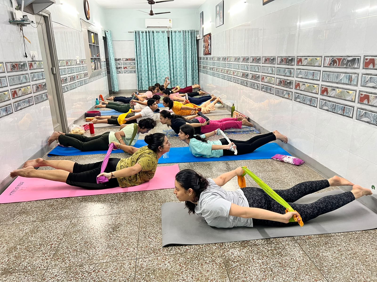 Face yoga session demonstrating gentle facial muscle exercises at Nirankari Yoga Centre, Gurugram